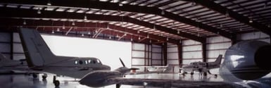 A couple of aircraft in a hangar