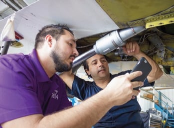 Aircraft Maintenance Technicians Performing Maintenance on REVA Aircraft